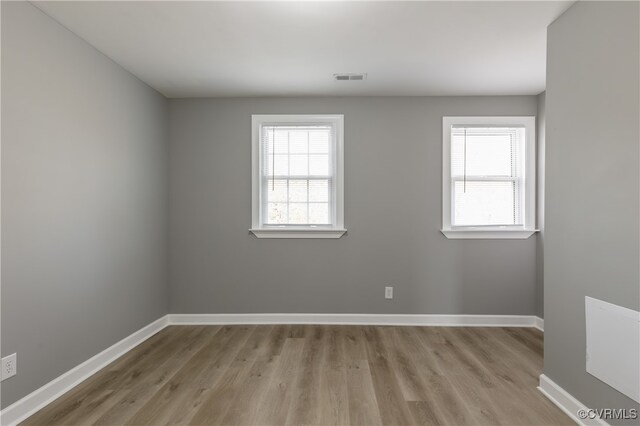 empty room with light hardwood / wood-style floors