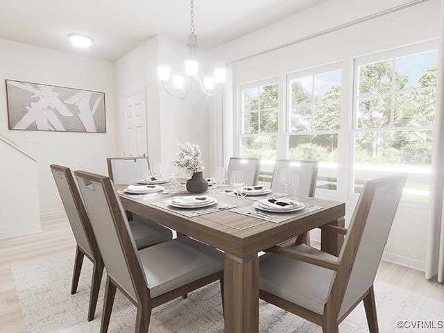 dining area with a chandelier and light hardwood / wood-style floors