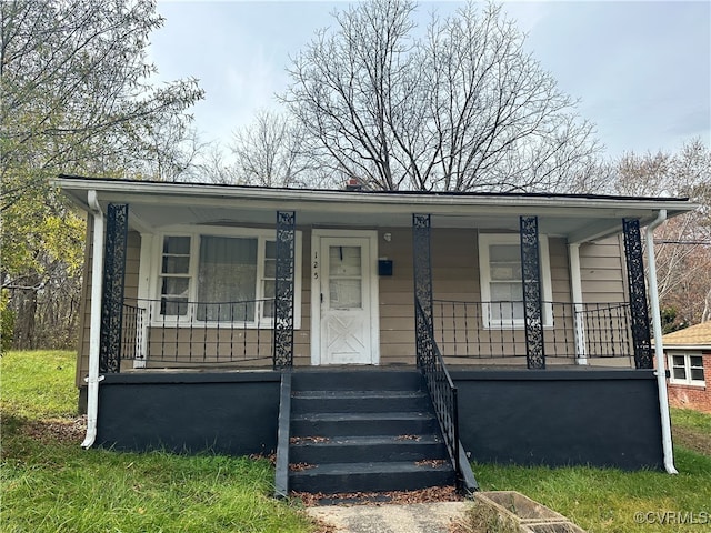 view of front of property featuring covered porch