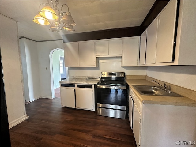 kitchen featuring sink, white cabinetry, stainless steel range with electric cooktop, and hanging light fixtures