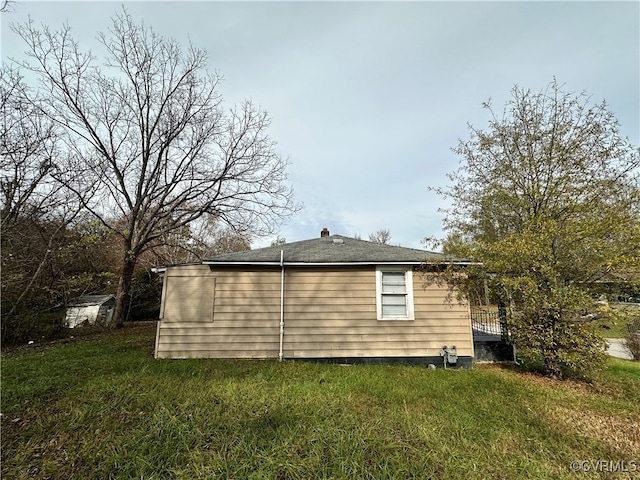 view of home's exterior featuring a lawn