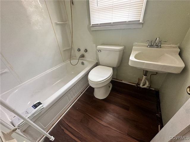 full bathroom with toilet, hardwood / wood-style floors, shower / bathing tub combination, and sink