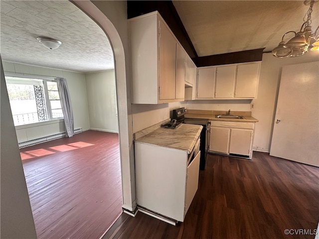 kitchen with dark hardwood / wood-style floors, black electric range oven, white cabinetry, and sink