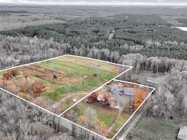 birds eye view of property with a rural view