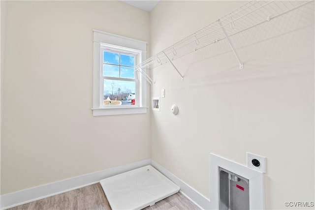 washroom with washer hookup, hardwood / wood-style floors, and electric dryer hookup