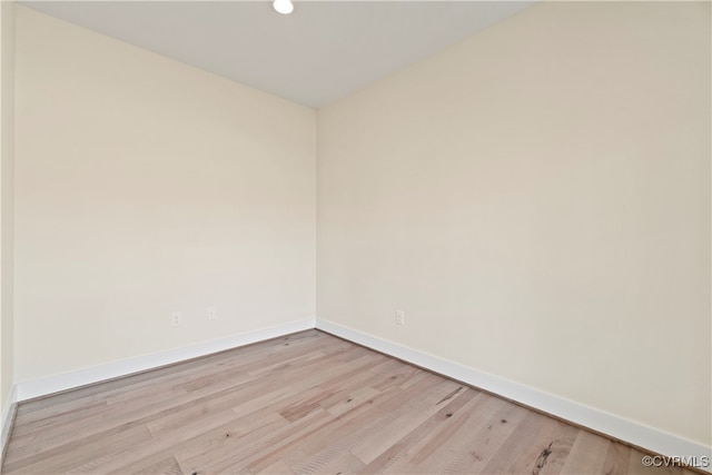 spare room with light wood-type flooring