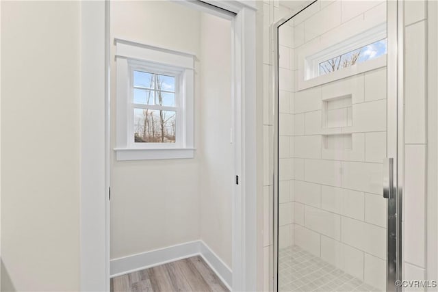TBD3 Rocky Ford Rd, Beaverdam, VA 23015 - full bathroom with wood finished floors, a healthy amount of sunlight, a stall shower, and baseboards