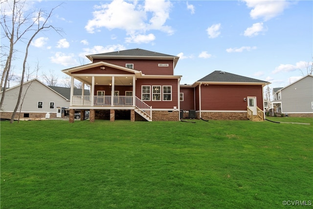 rear view of house with a lawn