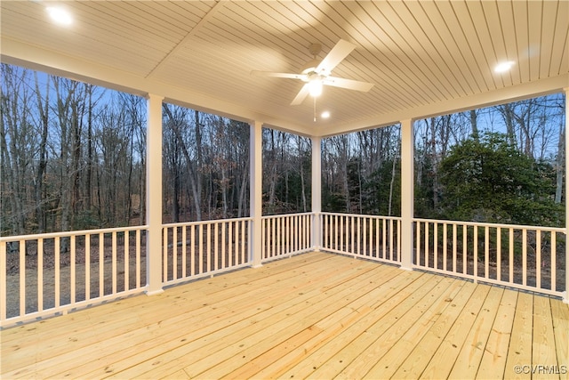 wooden deck featuring ceiling fan