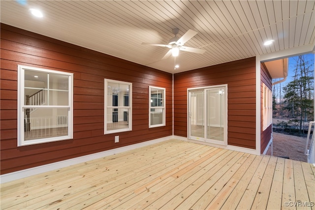 wooden terrace featuring ceiling fan