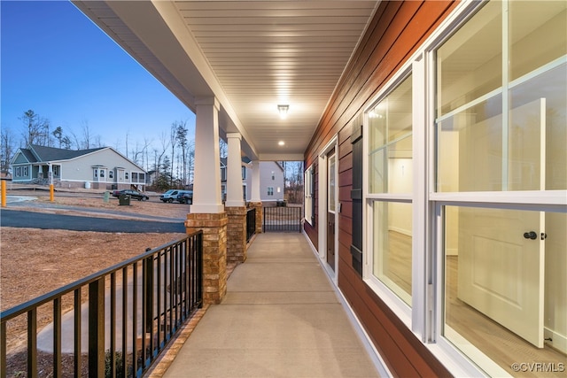 balcony at dusk with a porch