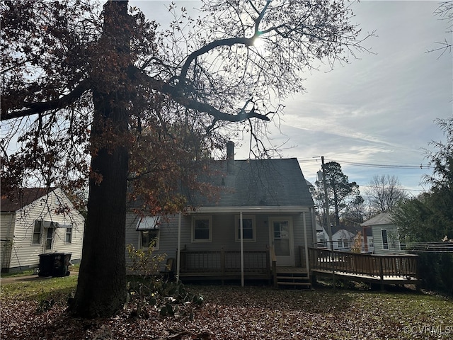 back of property with a wooden deck