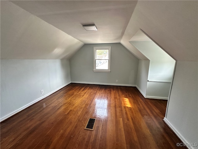 bonus room featuring dark hardwood / wood-style floors and lofted ceiling