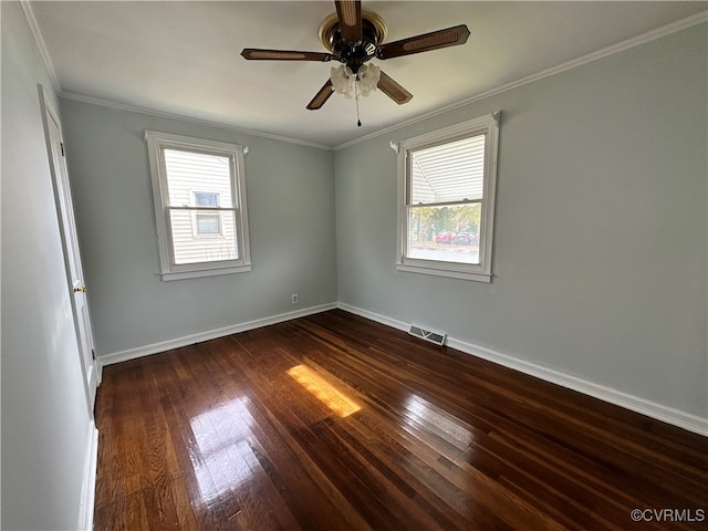 empty room featuring ceiling fan, dark hardwood / wood-style floors, and ornamental molding