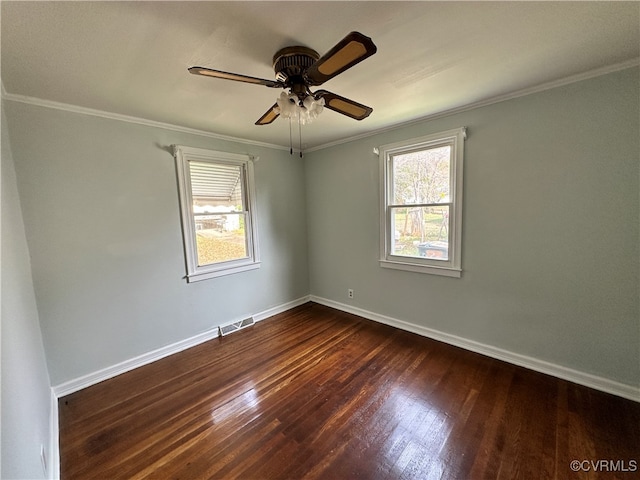 spare room with dark hardwood / wood-style floors, ceiling fan, and crown molding