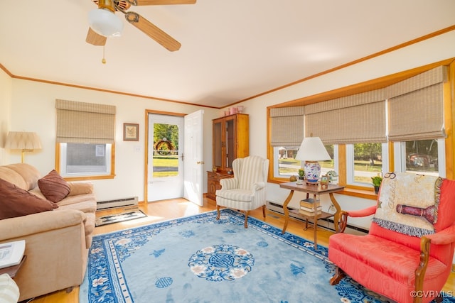 living room with hardwood / wood-style floors, baseboard heating, crown molding, and ceiling fan