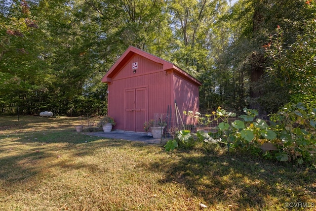 view of outbuilding with a lawn