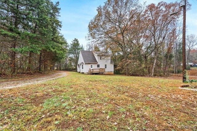 view of yard featuring a wooden deck