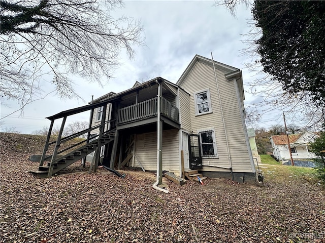 rear view of house with a balcony