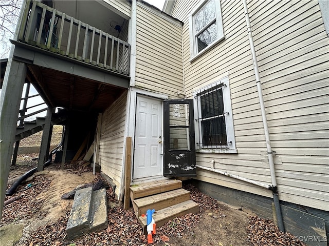 entrance to property with a balcony