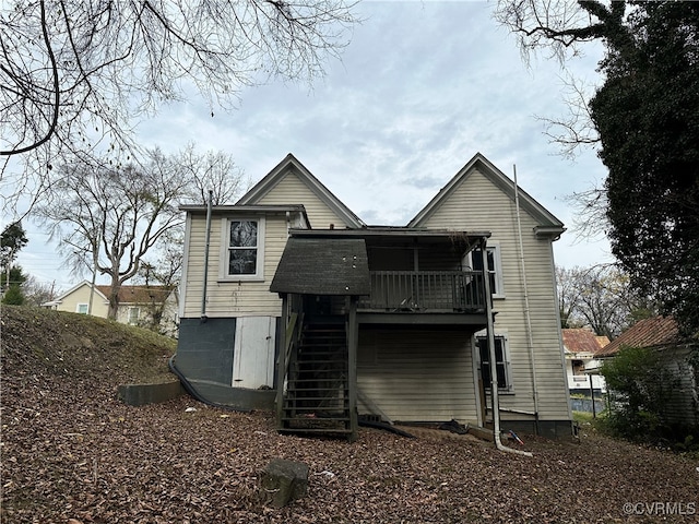 back of house with a balcony