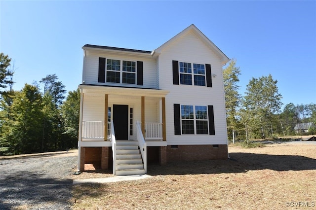 view of front of property featuring covered porch and crawl space