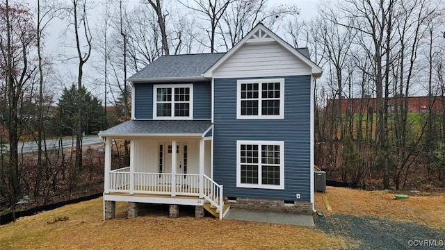 view of front of home featuring a porch and central AC