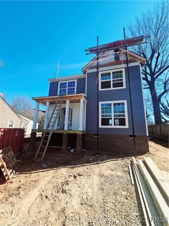 back of house featuring fence