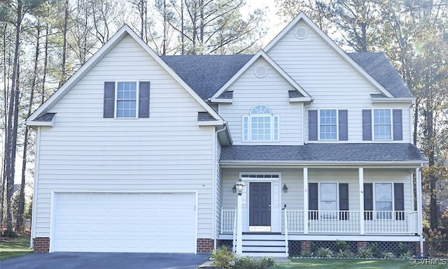 view of front of house with a porch and a garage