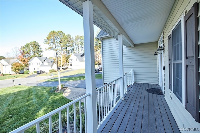 wooden terrace featuring covered porch