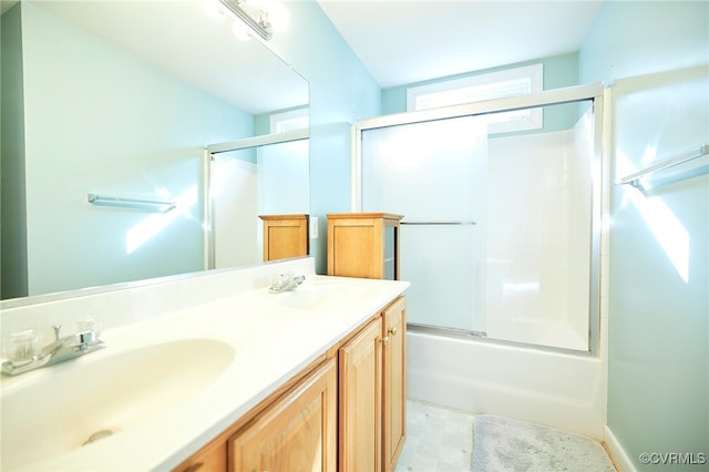 bathroom with vanity and enclosed tub / shower combo