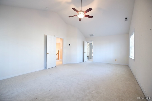 unfurnished room with light carpet, high vaulted ceiling, and ceiling fan