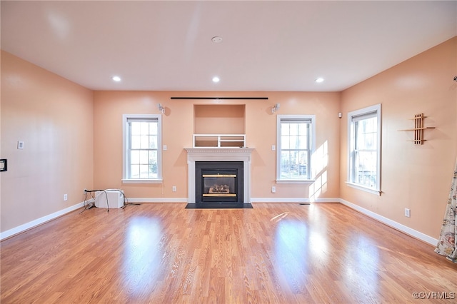 unfurnished living room featuring light hardwood / wood-style floors