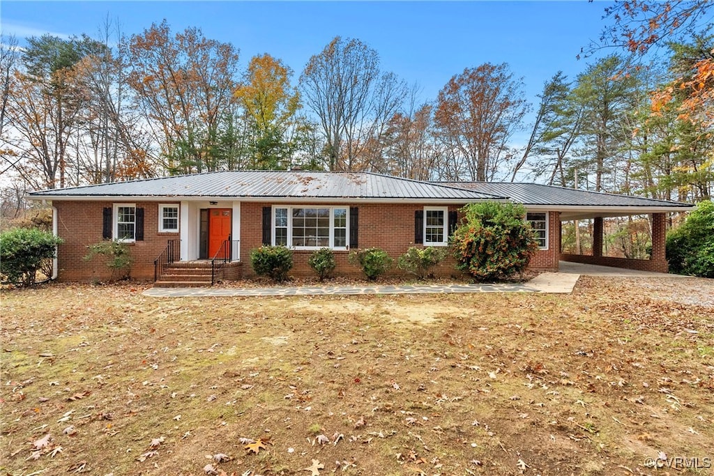 single story home featuring a carport