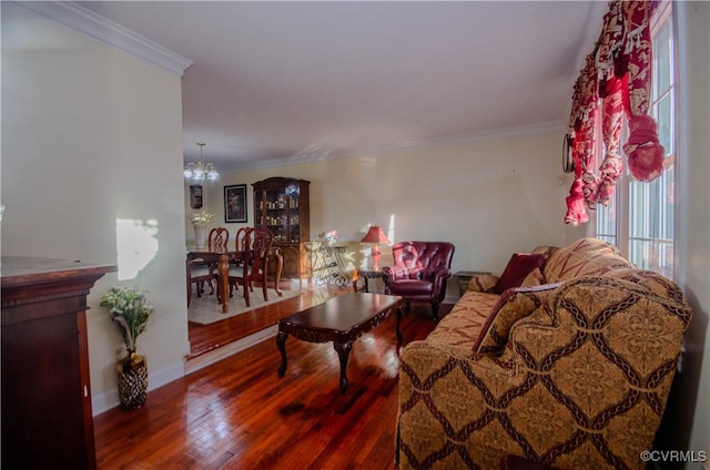 living room featuring an inviting chandelier, wood-type flooring, and ornamental molding