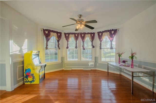 interior space with ceiling fan and hardwood / wood-style flooring