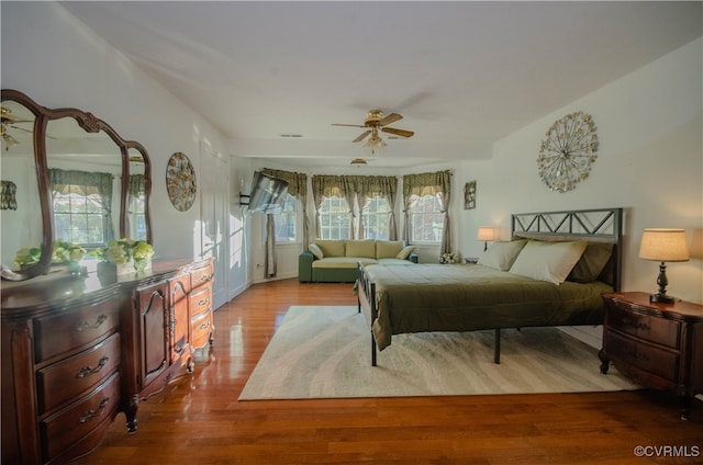 bedroom featuring ceiling fan and light hardwood / wood-style flooring