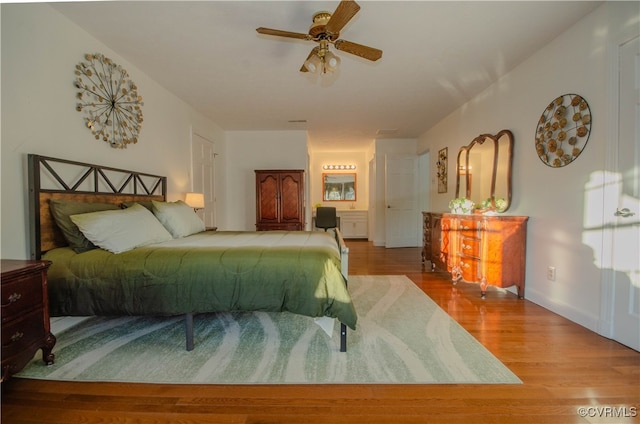 bedroom featuring hardwood / wood-style flooring and ceiling fan