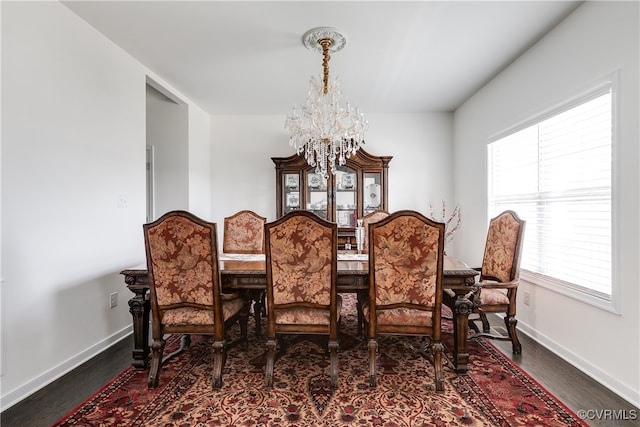 dining space featuring a notable chandelier