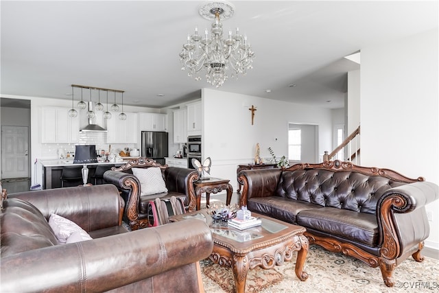 living room with an inviting chandelier