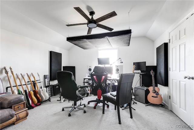 carpeted office featuring ceiling fan and vaulted ceiling