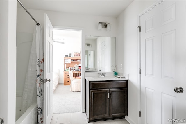 bathroom with tile patterned flooring, vanity, shower / bathtub combination with curtain, and ceiling fan