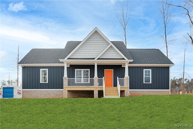 view of front of home featuring a porch and a front yard