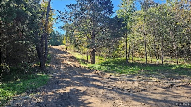 view of street featuring a wooded view