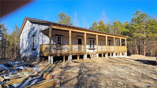 property in mid-construction featuring covered porch