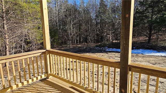 deck featuring a wooded view