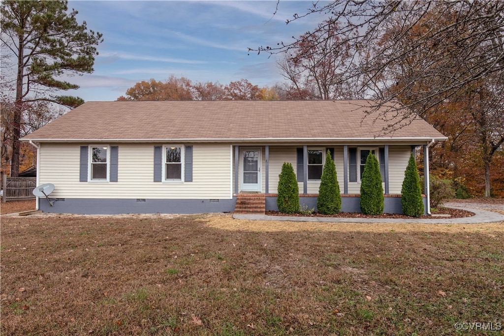 ranch-style house with a front yard