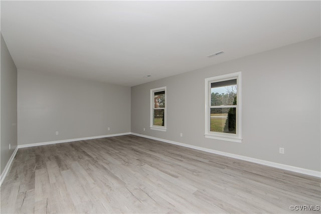 empty room with light hardwood / wood-style floors