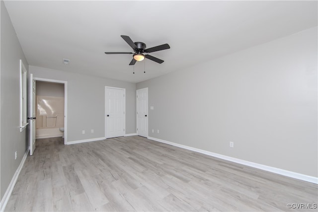 unfurnished bedroom with connected bathroom, ceiling fan, and light hardwood / wood-style floors