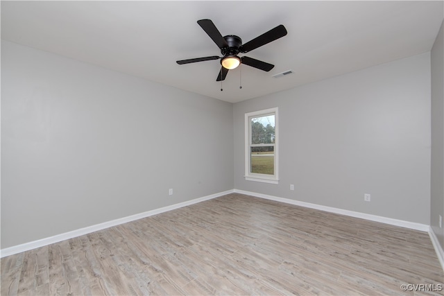 empty room with ceiling fan and light wood-type flooring